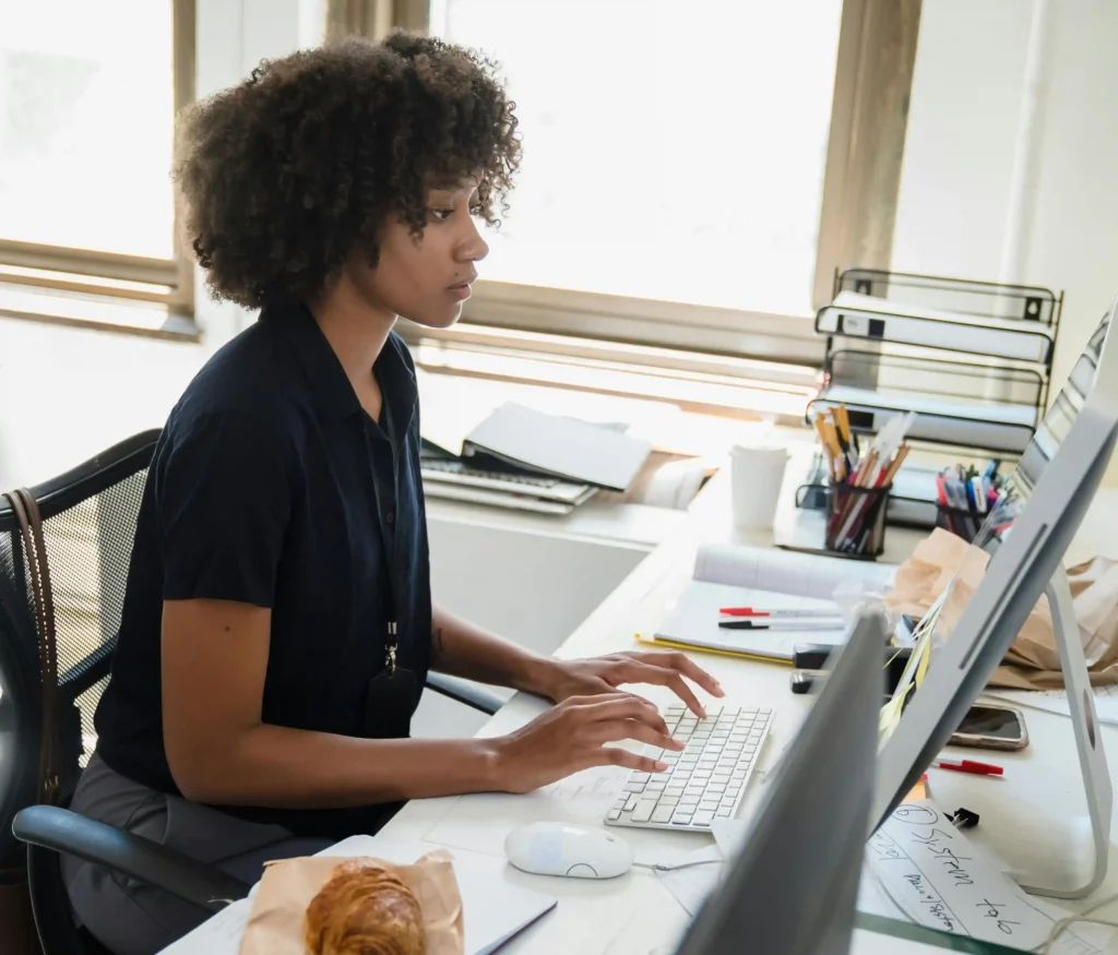 Boksburg web designer working at a desk on her computer